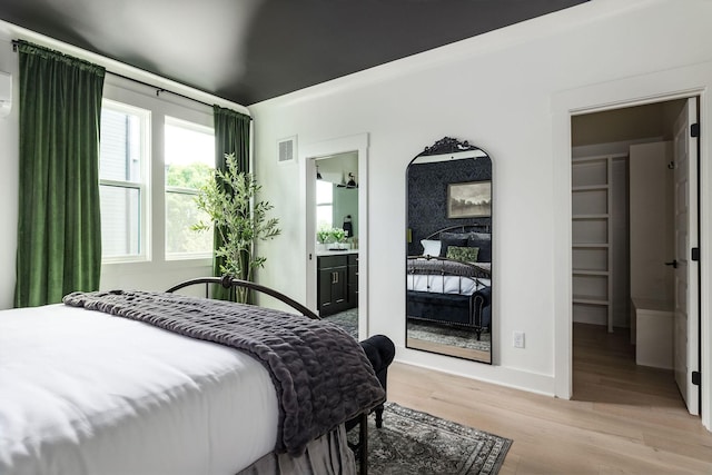 326A E Trinity Ln, Nashville, TN 37207 - bedroom with light wood-type flooring, ensuite bathroom, and baseboards