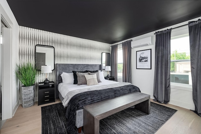 326A E Trinity Ln, Nashville, TN 37207 - bedroom with a wall mounted AC and light wood-style flooring