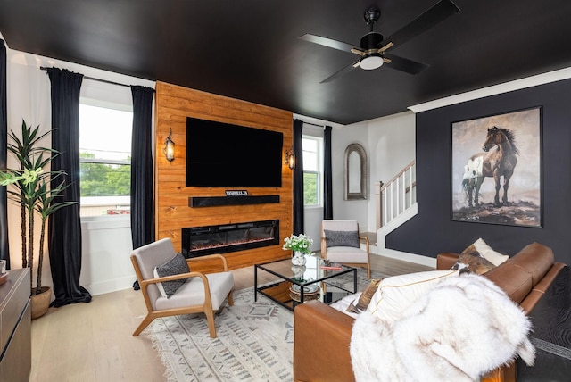 326A E Trinity Ln, Nashville, TN 37207 - living room with light wood finished floors, a fireplace, stairway, and ceiling fan