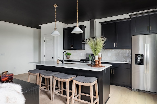 326A E Trinity Ln, Nashville, TN 37207 - kitchen with appliances with stainless steel finishes, a sink, dark cabinetry, light countertops, and tasteful backsplash