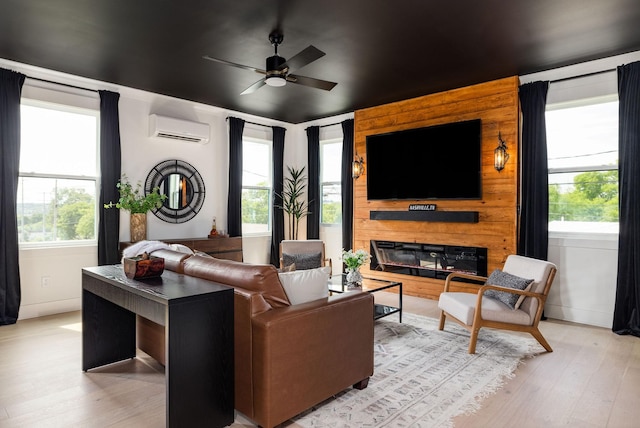326A E Trinity Ln, Nashville, TN 37207 - living area with an AC wall unit, a ceiling fan, light wood-type flooring, and healthy amount of natural light