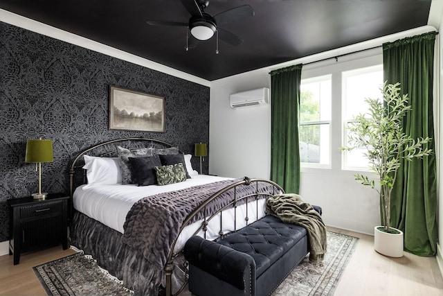 326A E Trinity Ln, Nashville, TN 37207 - bedroom with a wall mounted air conditioner, wood finished floors, wallpapered walls, ceiling fan, and baseboards