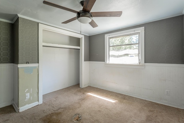 117 Westbrook Ave, Soddy Daisy, TN 37379 - unfurnished bedroom featuring a wainscoted wall, a closet, carpet, ornamental molding, and a ceiling fan