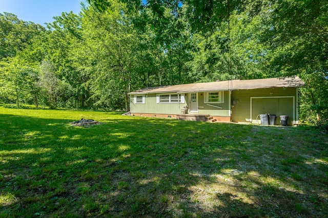 117 Westbrook Ave, Soddy Daisy, TN 37379 - view of front of property featuring an attached garage, crawl space, a front lawn, an outdoor fire pit, and a porch