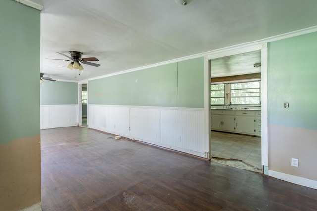 117 Westbrook Ave, Soddy Daisy, TN 37379 - empty room with ornamental molding, ceiling fan, a wainscoted wall, and wood finished floors