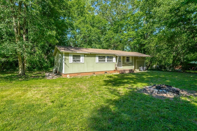 117 Westbrook Ave, Soddy Daisy, TN 37379 - single story home featuring crawl space, a front yard, and a fire pit
