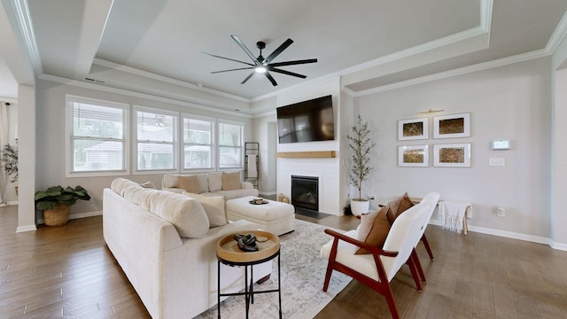 6614 Floral Ct, Murfreesboro, TN 37128 - living area featuring a ceiling fan, a fireplace with flush hearth, wood-type flooring, a raised ceiling, and ornamental molding