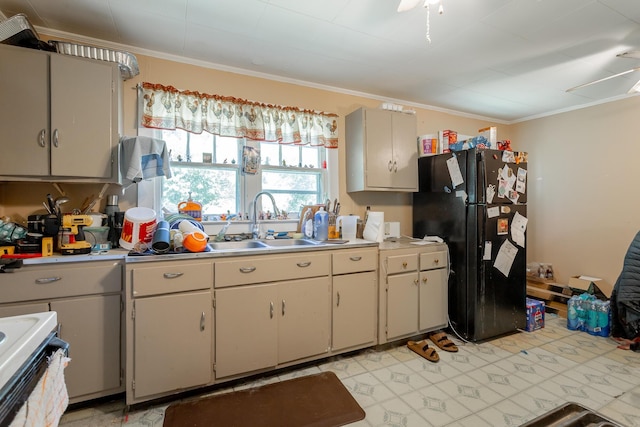 119 Westbrook Ave, Soddy Daisy, TN 37379 - kitchen featuring freestanding refrigerator, ornamental molding, a sink, light countertops, and stove