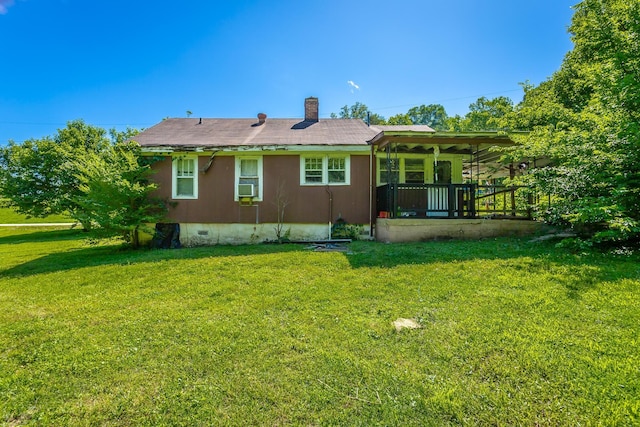 119 Westbrook Ave, Soddy Daisy, TN 37379 - back of property featuring covered porch, a lawn, a chimney, crawl space, and cooling unit