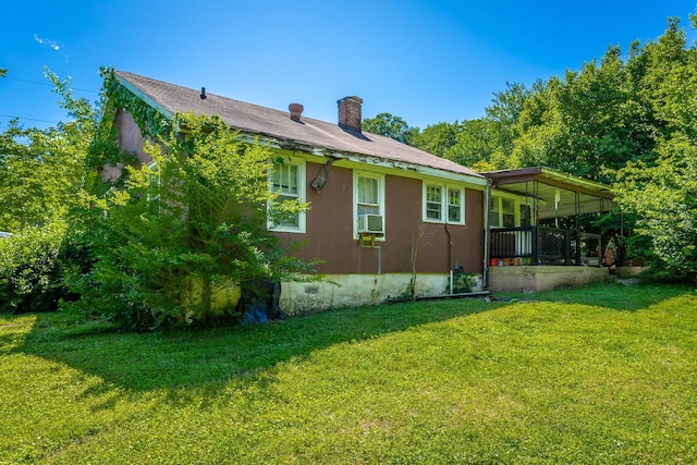 119 Westbrook Ave, Soddy Daisy, TN 37379 - view of side of home featuring a chimney and a lawn