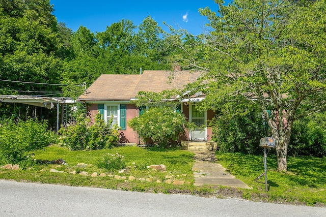 119 Westbrook Ave, Soddy Daisy, TN 37379 - obstructed view of property with a front lawn and a chimney