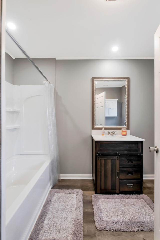 7464 Harrington Pl, Lyles, TN 37098 - full bath featuring vanity, baseboards, shower / tub combo, and wood finished floors