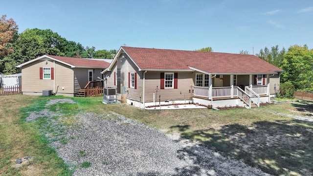 7464 Harrington Pl, Lyles, TN 37098 - view of front of house featuring a porch, central air condition unit, a front yard, and a shingled roof