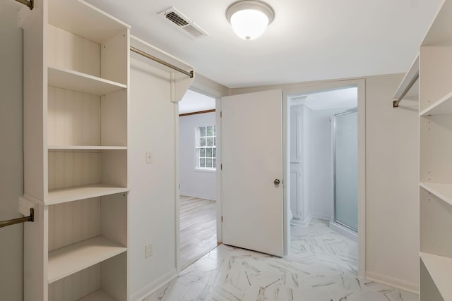 7464 Harrington Pl, Lyles, TN 37098 - spacious closet featuring light marble finish floors