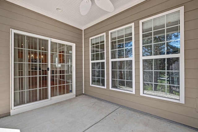 347 Blockade Ln, Mount Juliet, TN 37122 - unfurnished sunroom with a ceiling fan, wood walls, and concrete flooring