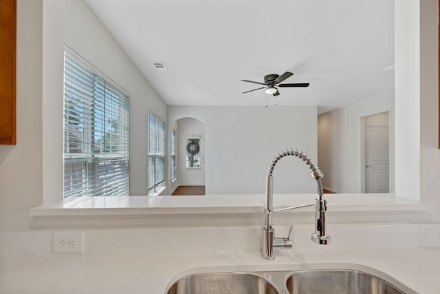 347 Blockade Ln, Mount Juliet, TN 37122 - kitchen view of a sink, ceiling fan, light countertops, and arched walkways