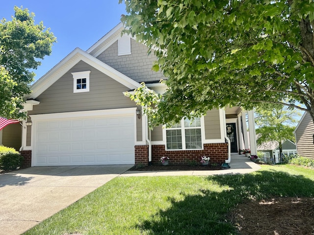 347 Blockade Ln, Mount Juliet, TN 37122 - view of front of home featuring brick siding, concrete driveway, a garage, and a front yard