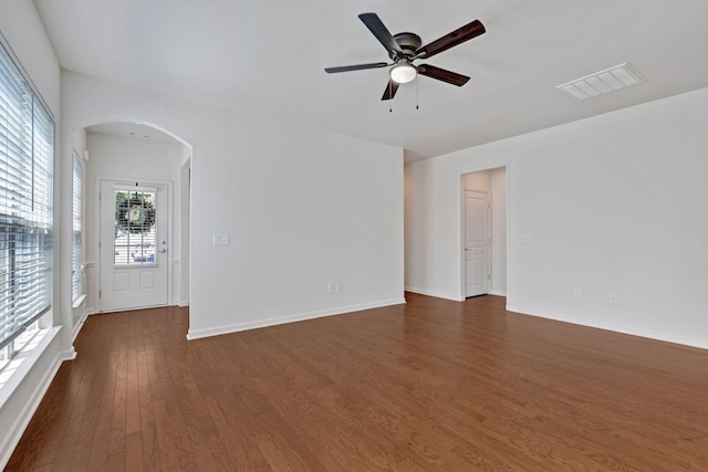 347 Blockade Ln, Mount Juliet, TN 37122 - unfurnished room with arched walkways, dark wood finished floors, ceiling fan, and baseboards