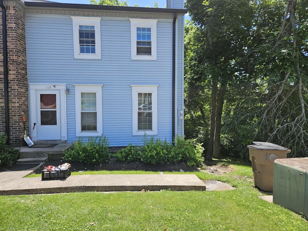 112 Elizabeths Ct, Antioch, TN 37013 - view of front facade featuring a front yard and a chimney