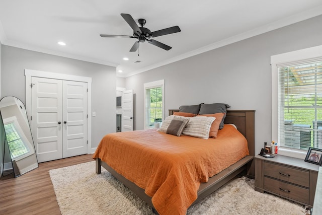 8035 Auburntown Rd, Auburntown, TN 37016 - bedroom with ornamental molding, light wood-style floors, recessed lighting, ceiling fan, and a closet