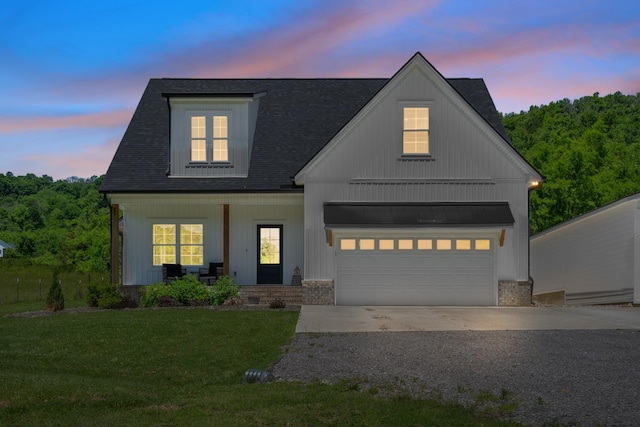 8035 Auburntown Rd, Auburntown, TN 37016 - modern inspired farmhouse with covered porch, a yard, driveway, a garage, and roof with shingles
