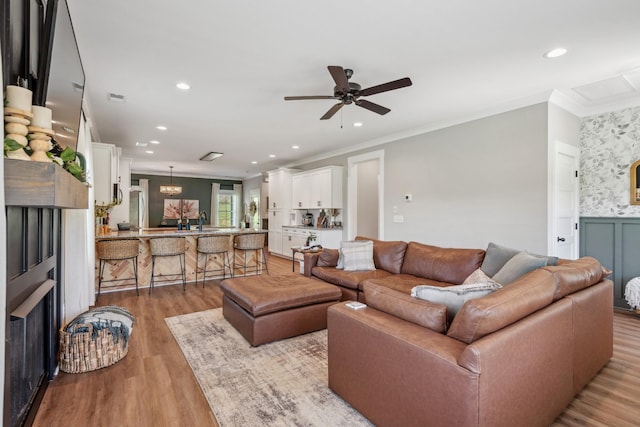 8035 Auburntown Rd, Auburntown, TN 37016 - living room featuring crown molding, light wood-style flooring, a ceiling fan, and recessed lighting