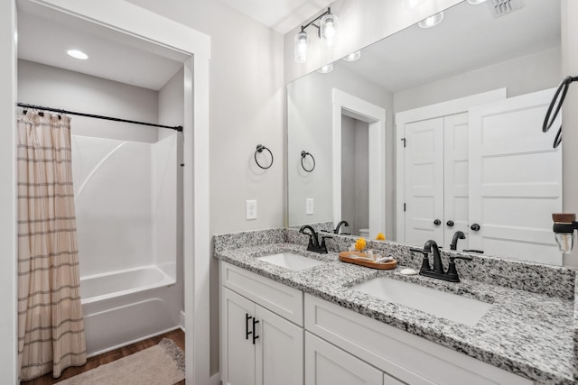 8035 Auburntown Rd, Auburntown, TN 37016 - bathroom with double vanity, shower / bathtub combination with curtain, and wood finished floors