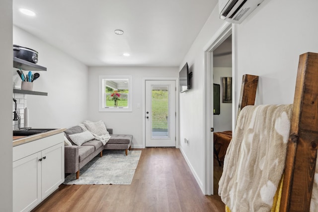 8035 Auburntown Rd, Auburntown, TN 37016 - entryway featuring light wood-style floors, recessed lighting, baseboards, and a wall unit AC