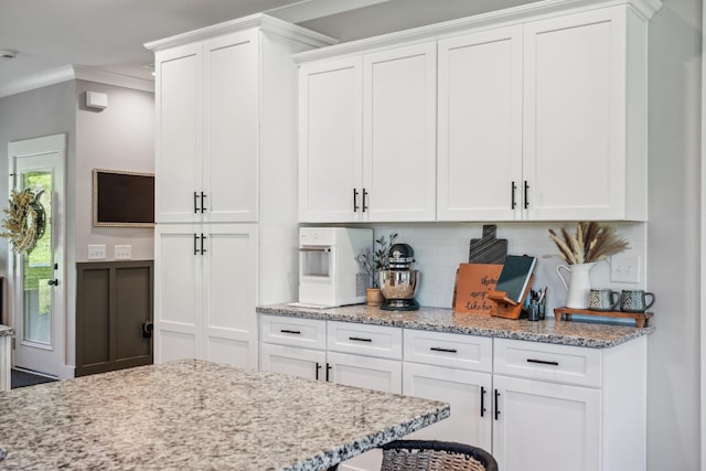8035 Auburntown Rd, Auburntown, TN 37016 - kitchen featuring backsplash, white cabinetry, light stone countertops, and ornamental molding