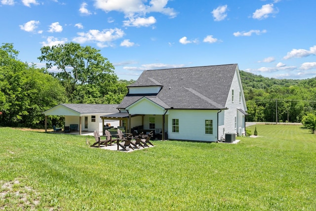 8035 Auburntown Rd, Auburntown, TN 37016 - rear view of house with central AC, a shingled roof, a patio, and a lawn