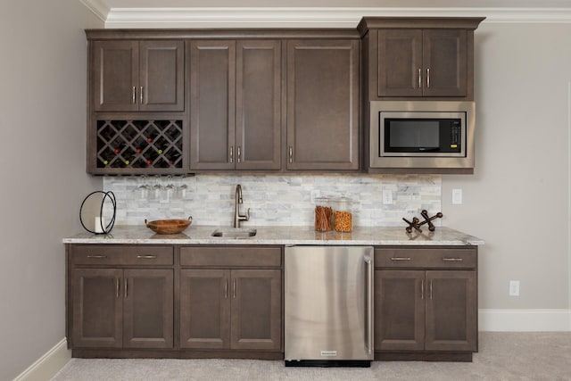 7243 Murrel Dr, Franklin, TN 37064 - indoor wet bar with appliances with stainless steel finishes, baseboards, and decorative backsplash