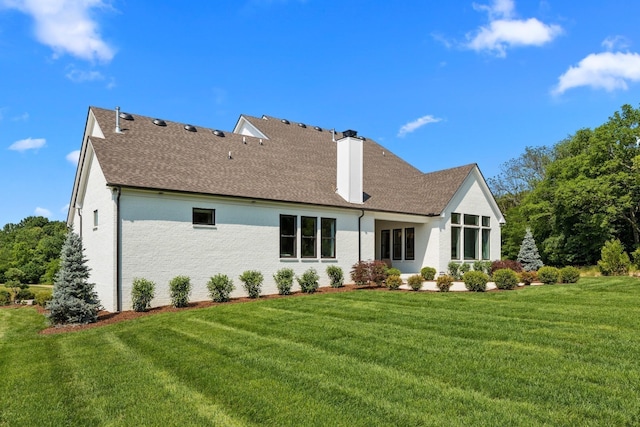 7243 Murrel Dr, Franklin, TN 37064 - rear view of house with a yard, roof with shingles, and a chimney