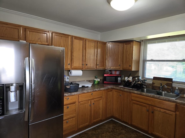 4548 Andrew Jackson Pkwy, Hermitage, TN 37076 - kitchen featuring stainless steel fridge with ice dispenser, black microwave, brown cabinets, a sink, and dark countertops