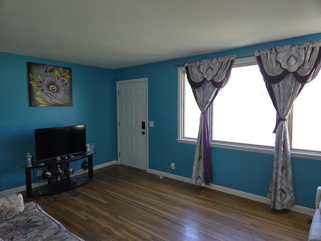 4548 Andrew Jackson Pkwy, Hermitage, TN 37076 - unfurnished living room featuring wood finished floors and baseboards