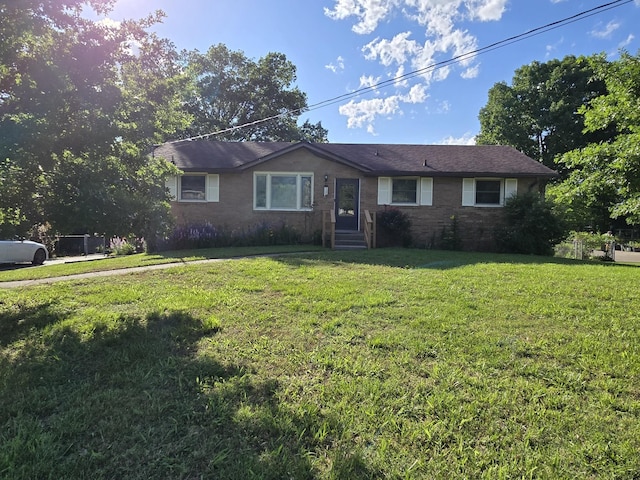4548 Andrew Jackson Pkwy, Hermitage, TN 37076 - ranch-style house featuring a front lawn and brick siding