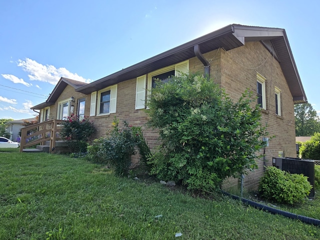 4548 Andrew Jackson Pkwy, Hermitage, TN 37076 - view of side of home featuring brick siding and a lawn