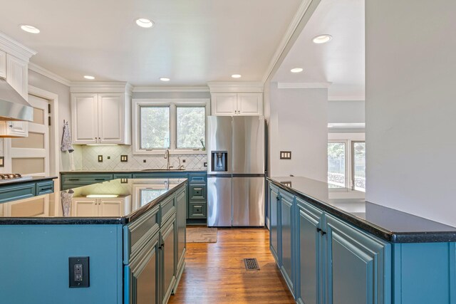 1135 Riverwood Dr, Nashville, TN 37216 - kitchen featuring stainless steel fridge with ice dispenser, healthy amount of natural light, a sink, white cabinetry, and recessed lighting