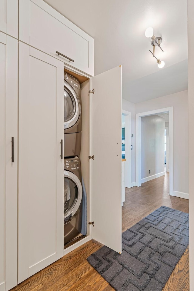 1135 Riverwood Dr, Nashville, TN 37216 - washroom featuring stacked washer / drying machine, wood finished floors, and baseboards