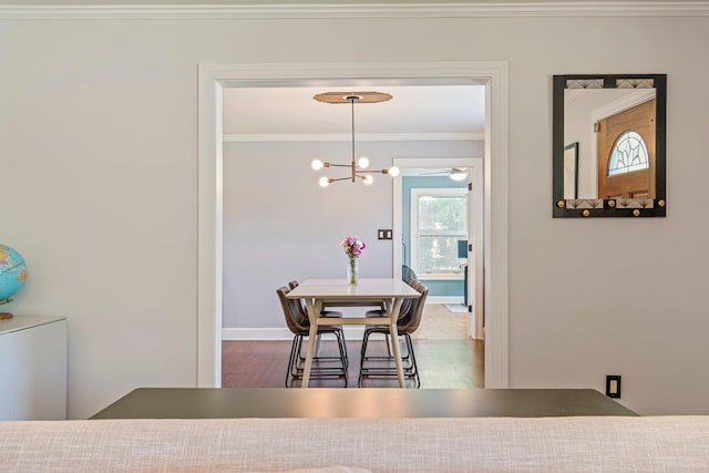 1135 Riverwood Dr, Nashville, TN 37216 - dining space featuring ornamental molding, a chandelier, wood finished floors, and baseboards