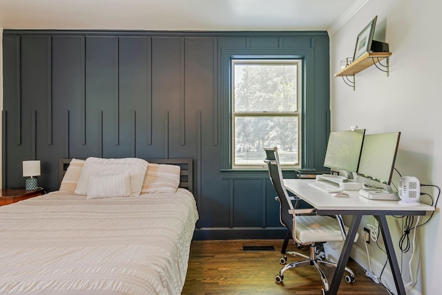 1135 Riverwood Dr, Nashville, TN 37216 - bedroom featuring ornamental molding, dark wood-type flooring, an office area, and a decorative wall