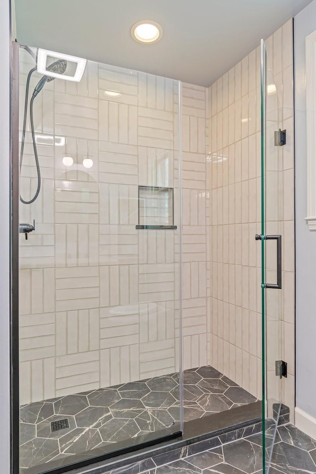 1135 Riverwood Dr, Nashville, TN 37216 - bathroom with a stall shower, marble look tile flooring, recessed lighting, and baseboards
