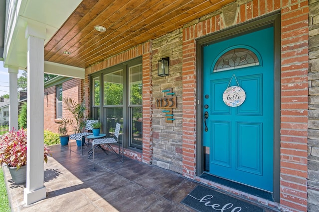 1135 Riverwood Dr, Nashville, TN 37216 - doorway to property with brick siding and covered porch