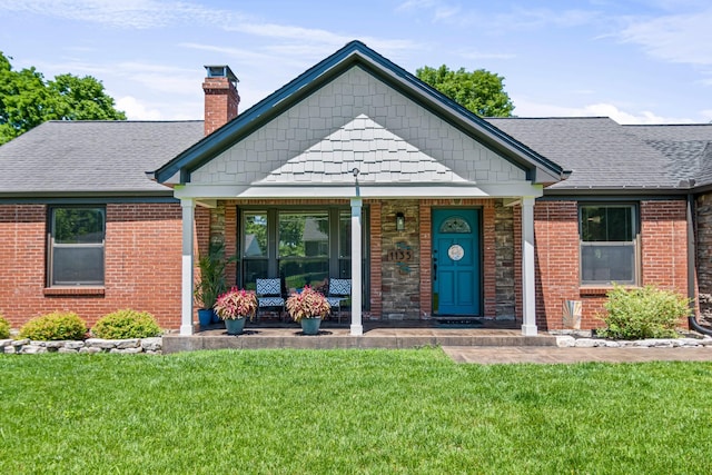 1135 Riverwood Dr, Nashville, TN 37216 - view of front of house with a chimney, a front yard, covered porch, and a shingled roof