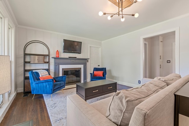 1135 Riverwood Dr, Nashville, TN 37216 - living area featuring ornamental molding, wood finished floors, a brick fireplace, a chandelier, and baseboards