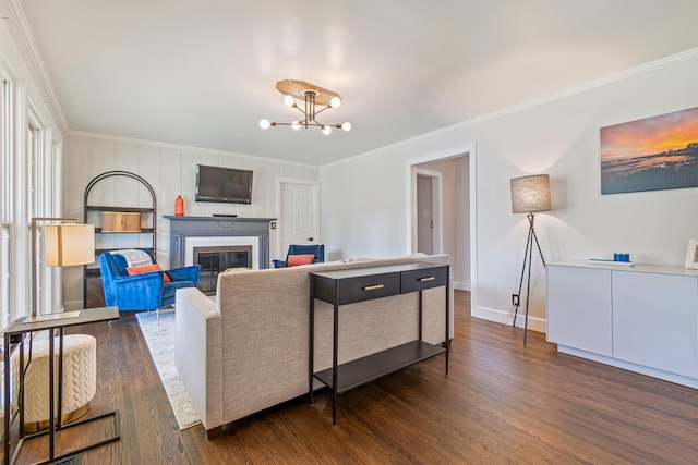1135 Riverwood Dr, Nashville, TN 37216 - living area featuring ornamental molding, dark wood-style floors, a chandelier, a brick fireplace, and baseboards