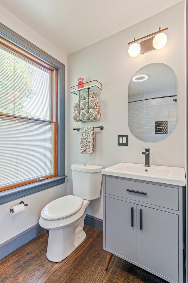 1135 Riverwood Dr, Nashville, TN 37216 - full bathroom featuring vanity, toilet, wood finished floors, baseboards, and a shower