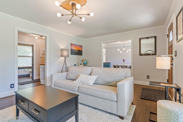 1135 Riverwood Dr, Nashville, TN 37216 - living room featuring a chandelier, crown molding, wood finished floors, and baseboards