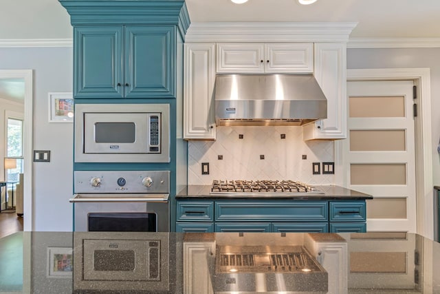 1135 Riverwood Dr, Nashville, TN 37216 - kitchen featuring stainless steel appliances, ventilation hood, blue cabinets, and crown molding