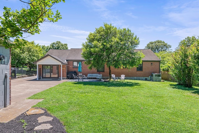 1135 Riverwood Dr, Nashville, TN 37216 - rear view of property featuring brick siding, a patio, cooling unit, and a shingled roof