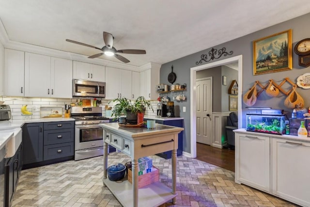 3130 Valley Bend Rd, Murfreesboro, TN 37129 - kitchen featuring appliances with stainless steel finishes, brick floors, white cabinetry, decorative backsplash, and light countertops
